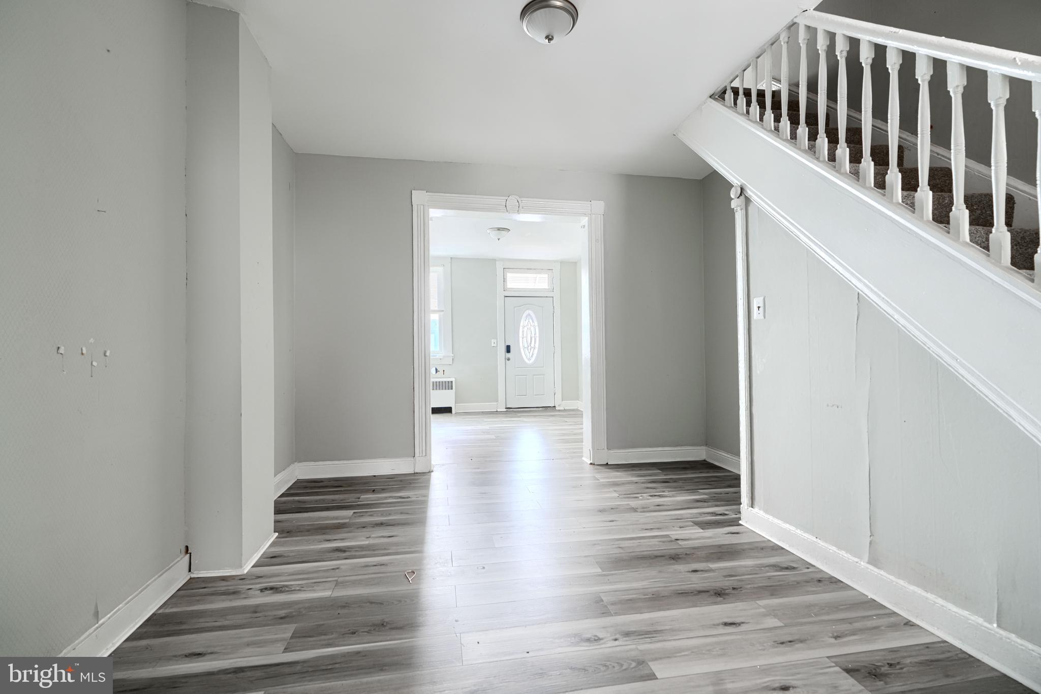 216 South High Street Baltimore, MD 21202 - Photo 8 of 25 a view of a hallway with wooden floor and staircase