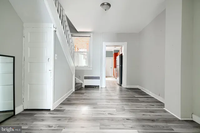 a view of a kitchen with a refrigerator