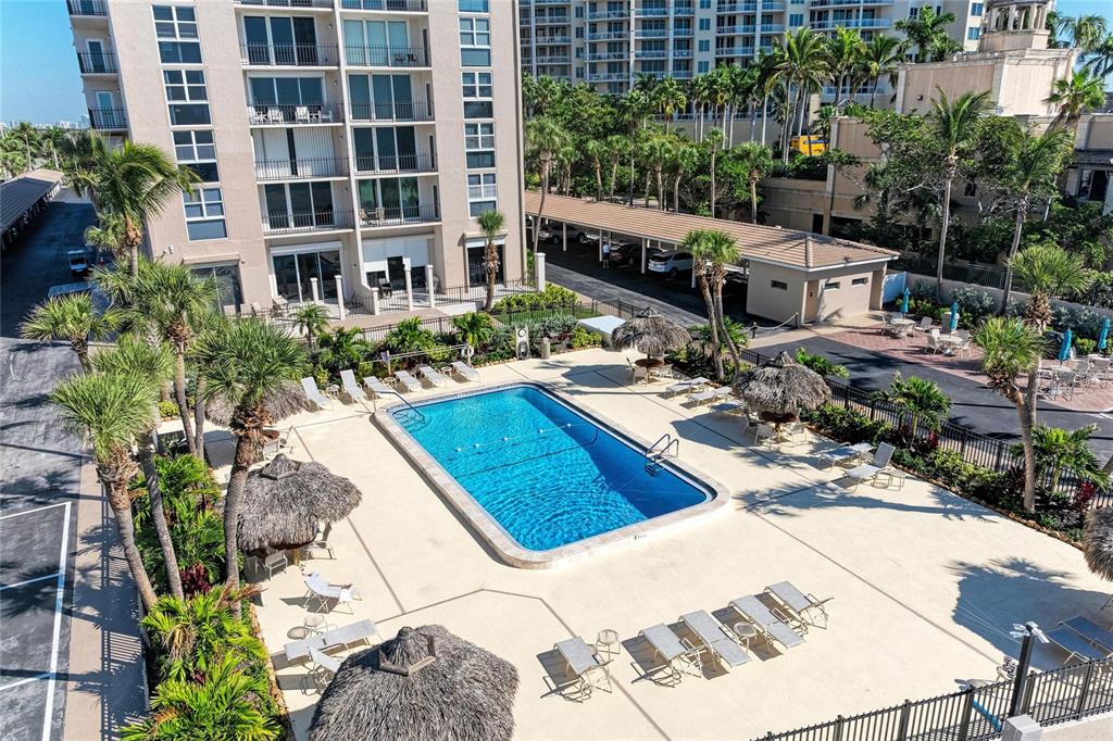 1212 Benjamin Franklin Drive, Unit 208 Sarasota, FL 34236 - Photo 25 of 32 a view of a backyard with sitting area