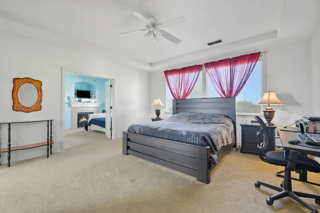 a bedroom with a bed a desk and chair