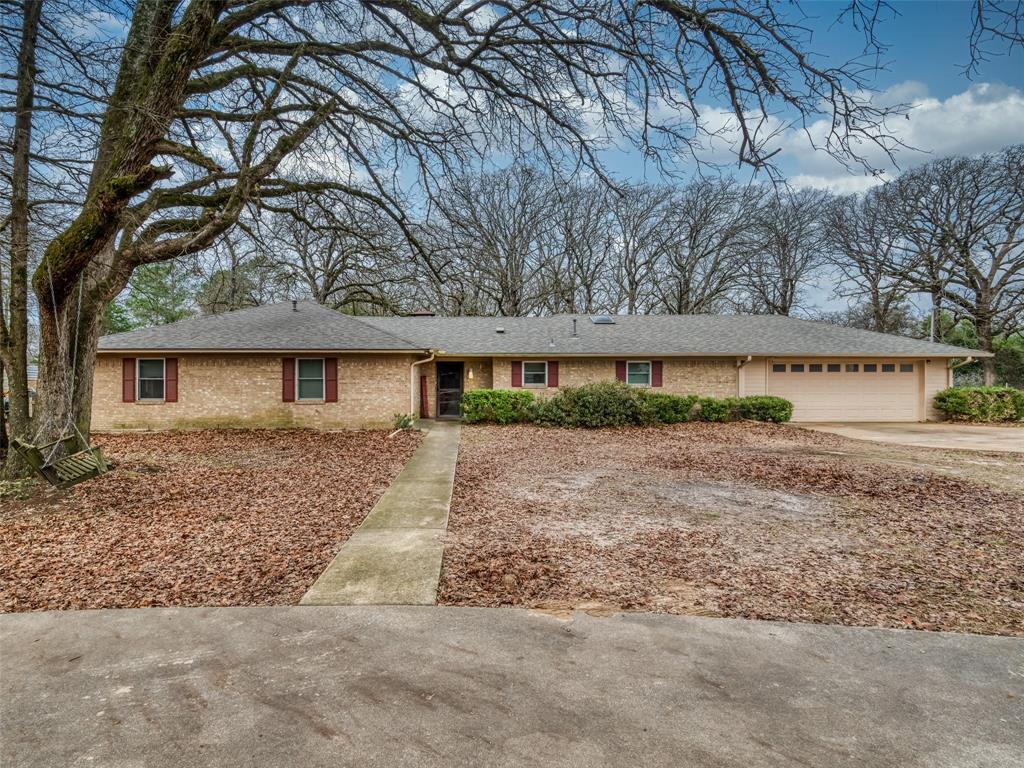 9663 Matise Street Tyler, TX 75706 - Photo 1 of 15 a view of a yard with large tree