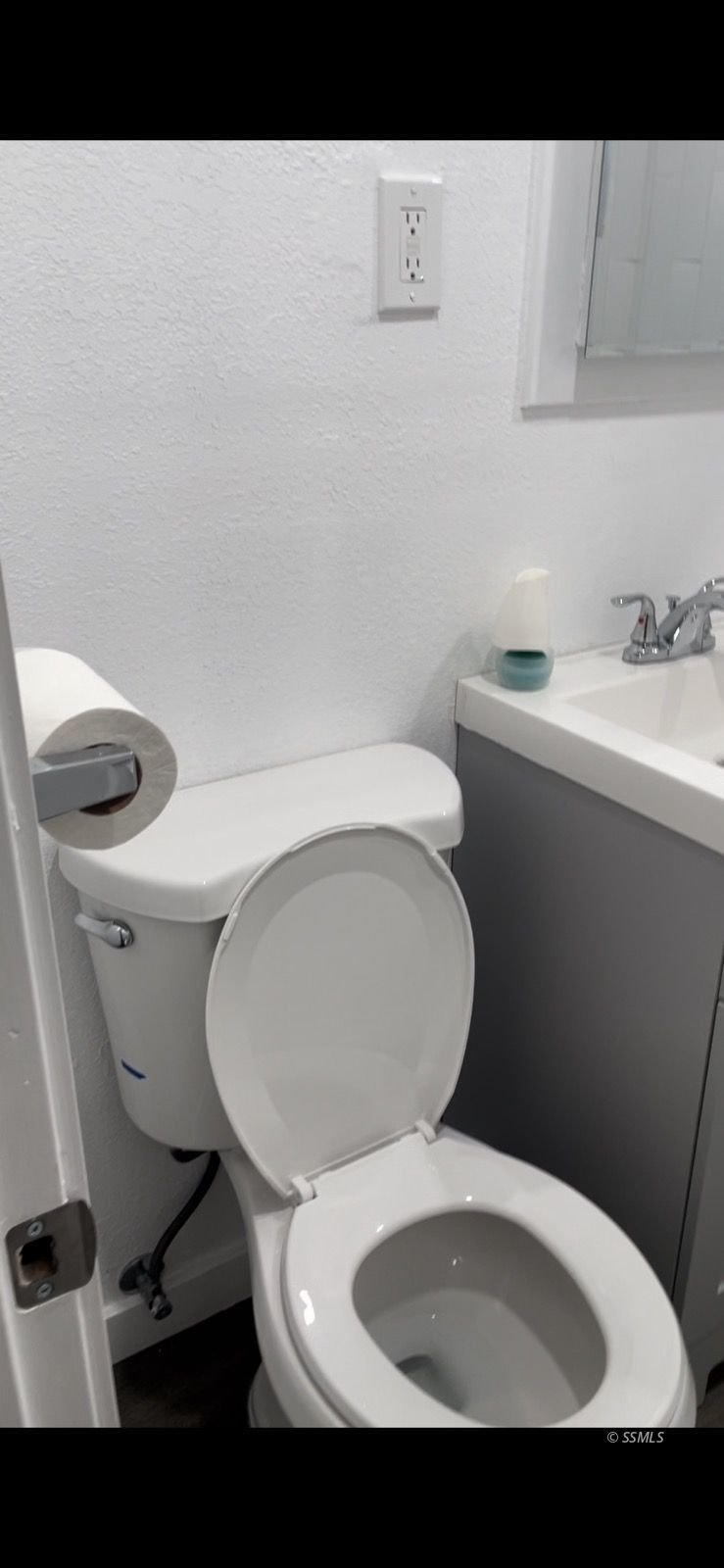 238 South Warner Street Ridgecrest, CA 93555 - Photo 15 of 15 a white toilet sitting next to a white sink and vanity