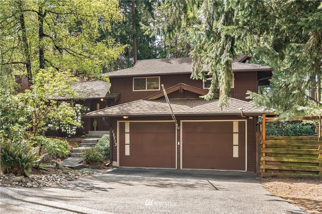 15713 Southeast 148th Street Renton, WA 98059 - Photo 2 of 39 a front view of a house with a yard