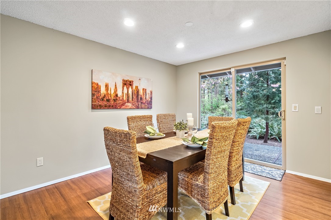 15713 Southeast 148th Street Renton, WA 98059 - Photo 11 of 39 a dining room with furniture and a large window