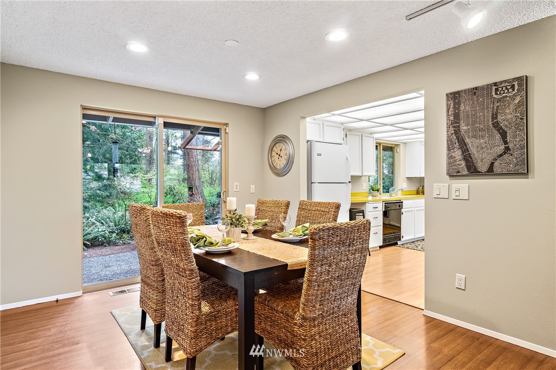 15713 Southeast 148th Street Renton, WA 98059 - Photo 12 of 39 a dining room with furniture and window