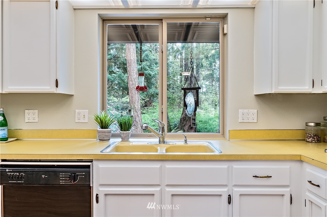 15713 Southeast 148th Street Renton, WA 98059 - Photo 14 of 39 a kitchen with a sink and a window