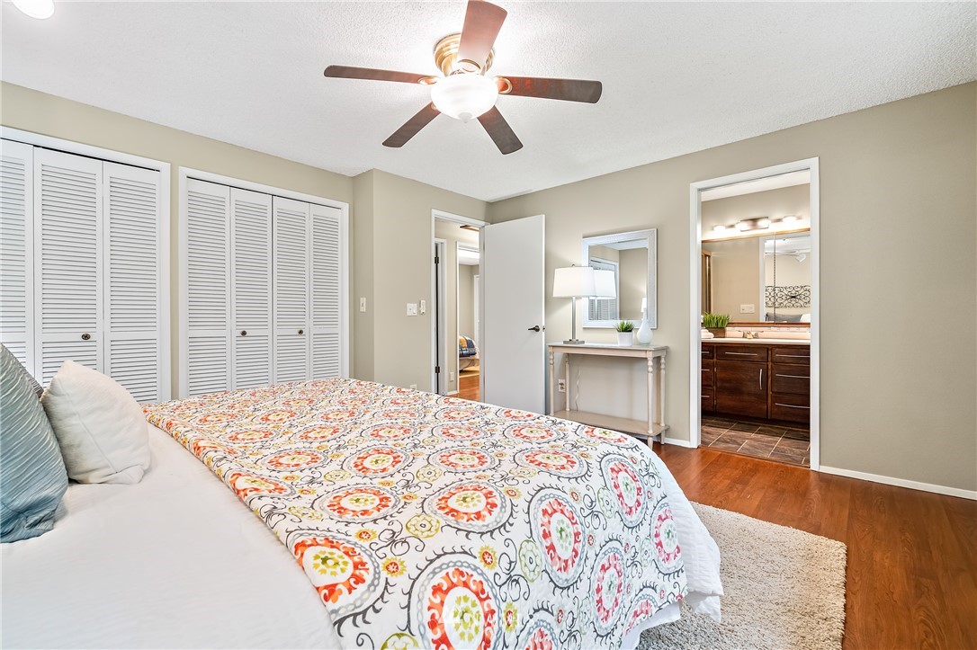 15713 Southeast 148th Street Renton, WA 98059 - Photo 18 of 39 a bedroom with a bed and a chandelier