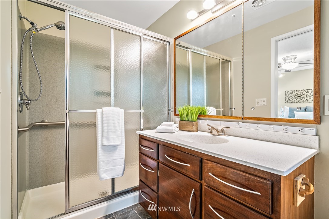 15713 Southeast 148th Street Renton, WA 98059 - Photo 19 of 39 a bathroom with a sink and a mirror