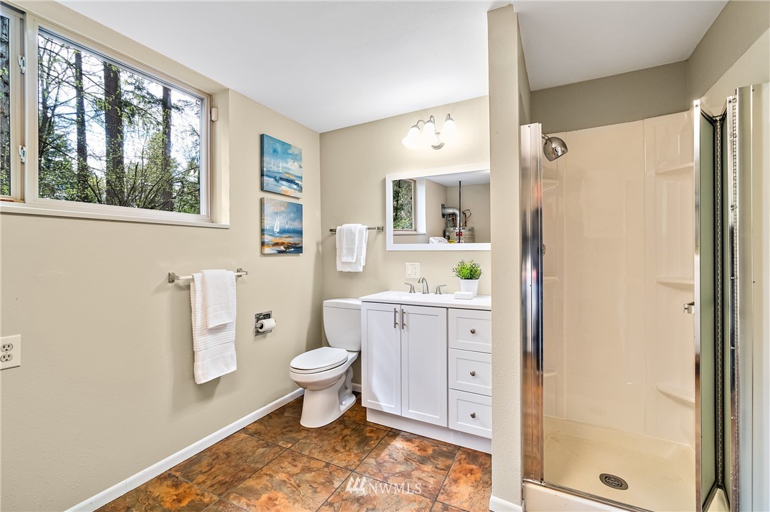 15713 Southeast 148th Street Renton, WA 98059 - Photo 23 of 39 a bathroom with a toilet sink and a mirror