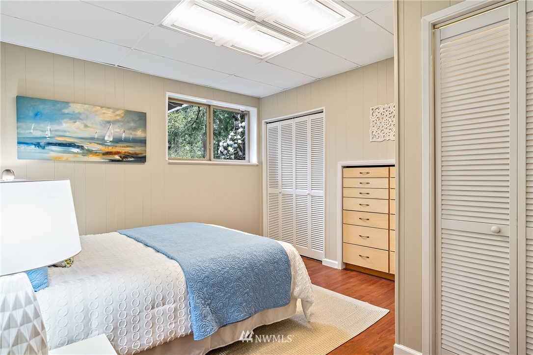 15713 Southeast 148th Street Renton, WA 98059 - Photo 25 of 39 a bedroom with a bed and a window