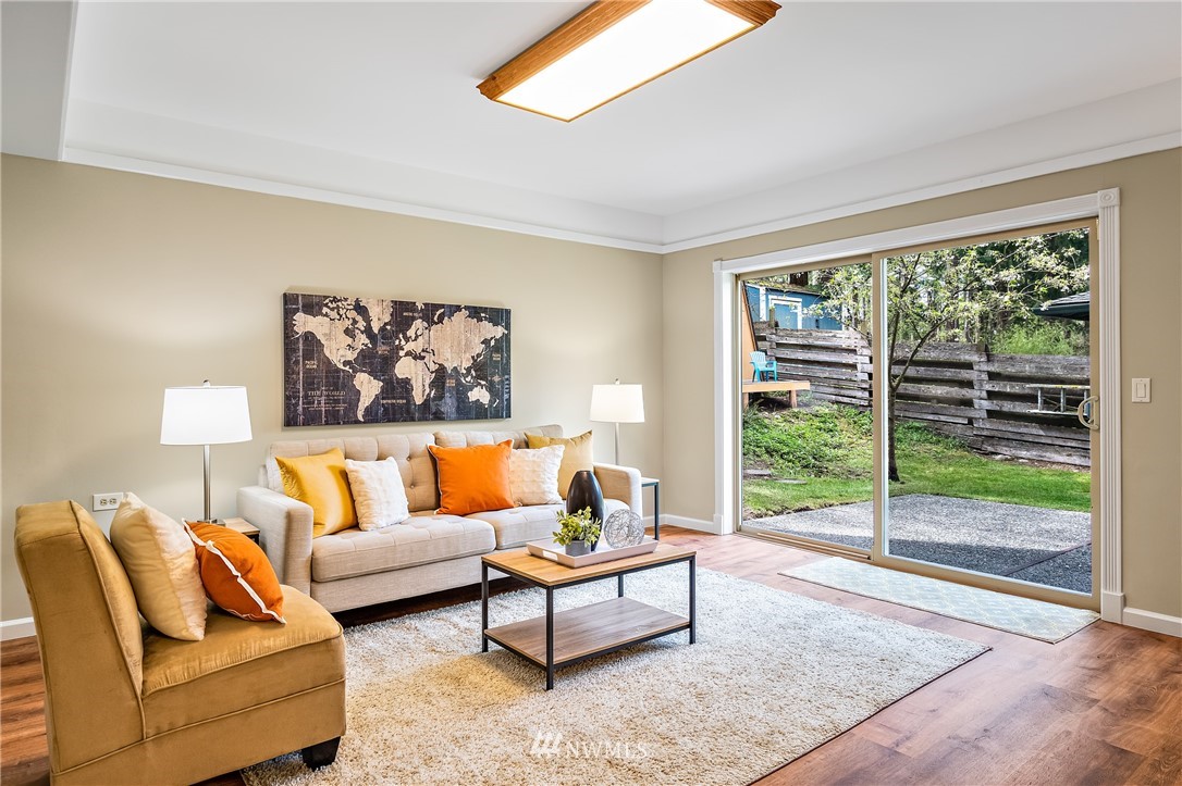 15713 Southeast 148th Street Renton, WA 98059 - Photo 26 of 39 a living room with furniture and a large window