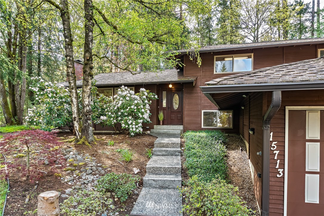 15713 Southeast 148th Street Renton, WA 98059 - Photo 4 of 39 a front view of a house with garden