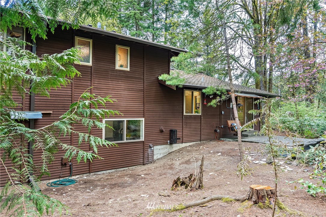 15713 Southeast 148th Street Renton, WA 98059 - Photo 34 of 39 a view of a house with a yard and sitting area
