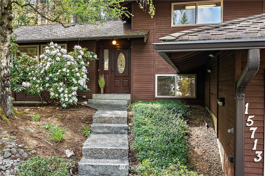 15713 Southeast 148th Street Renton, WA 98059 - Photo 5 of 39 a view of a pathway door of house