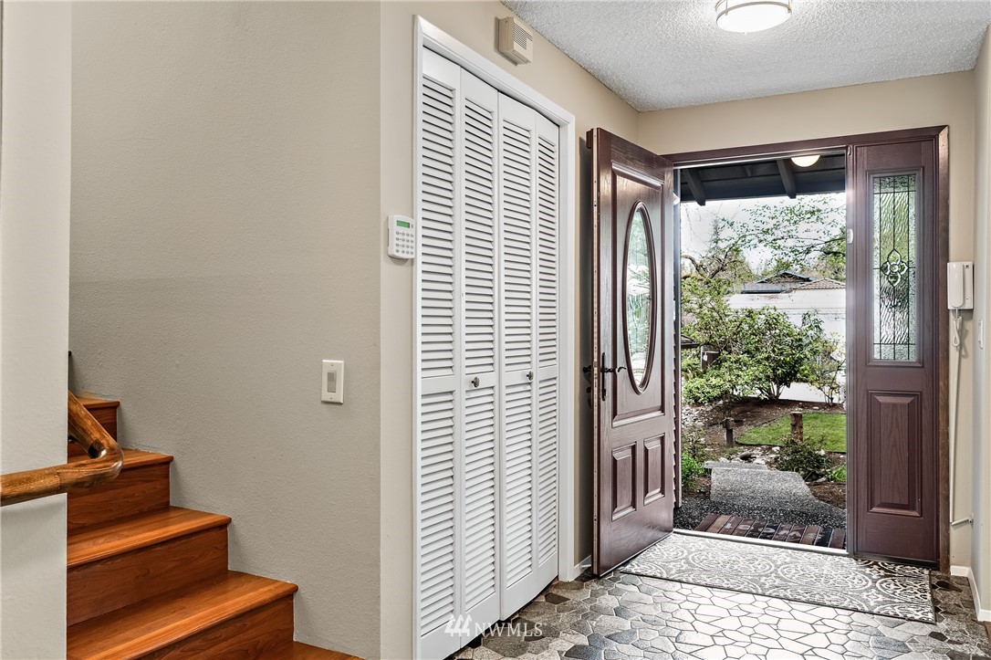 15713 Southeast 148th Street Renton, WA 98059 - Photo 7 of 39 a view of a hallway with windows and stairs