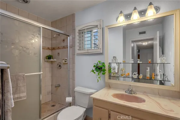 a bathroom with a shower and a toilet