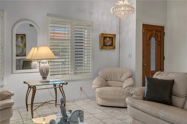 a dining room with furniture and window