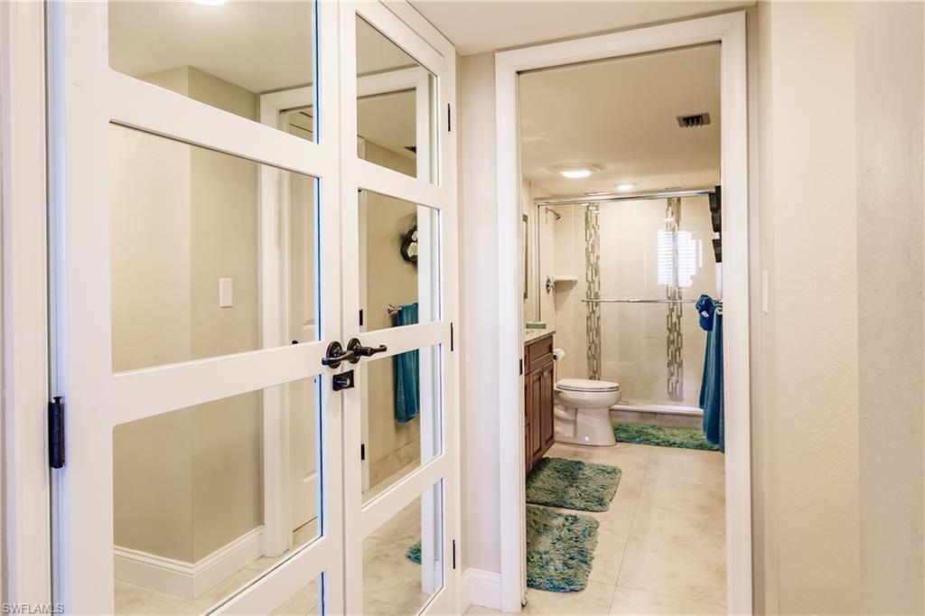 17 Bluebill Avenue, Unit 1005R Naples, FL 34108 - Photo 15 of 33 a bathroom with a shower and a sink