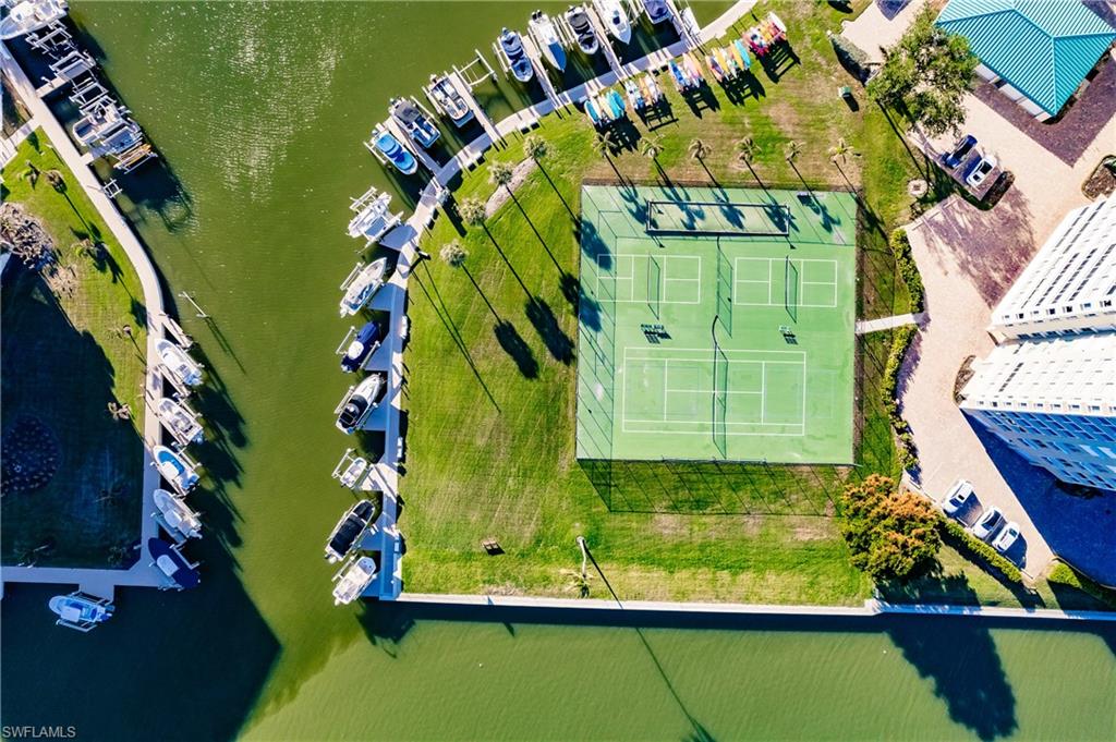 17 Bluebill Avenue, Unit 1005R Naples, FL 34108 - Photo 28 of 33 an aerial view of a residential houses with outdoor space and swimming pool