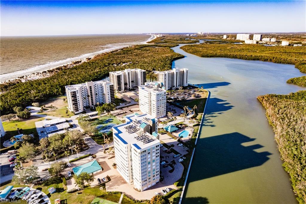 17 Bluebill Avenue, Unit 1005R Naples, FL 34108 - Photo 30 of 33 a view of city and ocean with boats