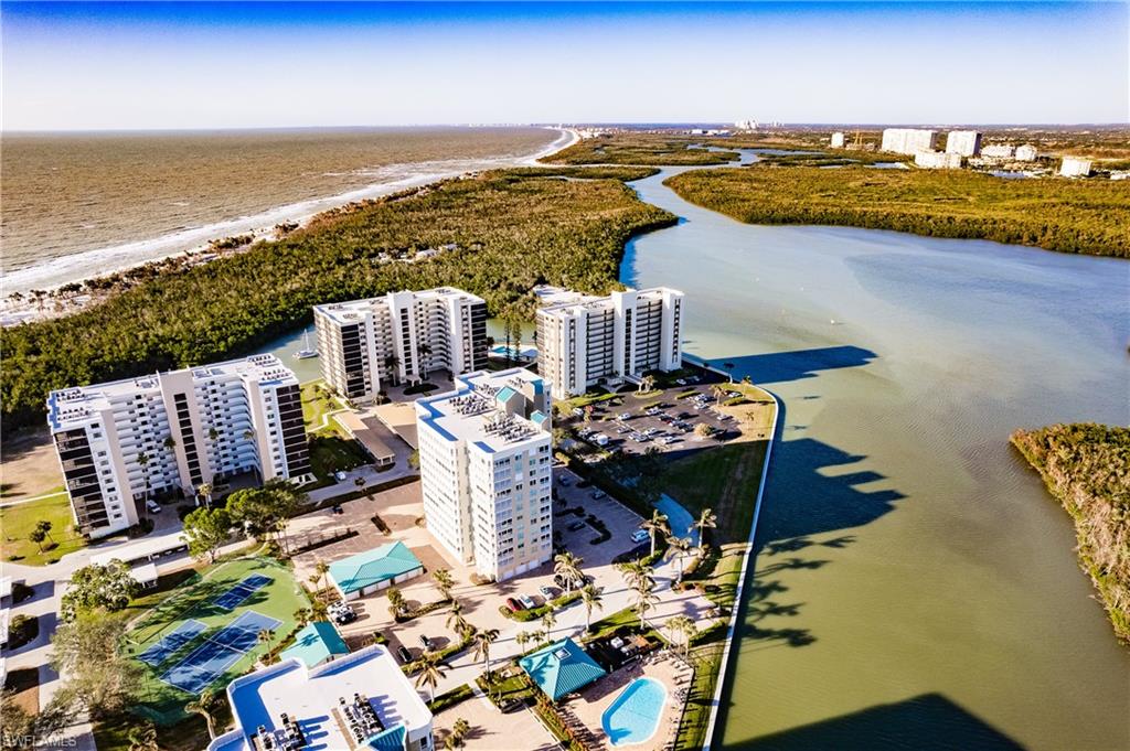 17 Bluebill Avenue, Unit 1005R Naples, FL 34108 - Photo 31 of 33 a view of a balcony with an ocean view
