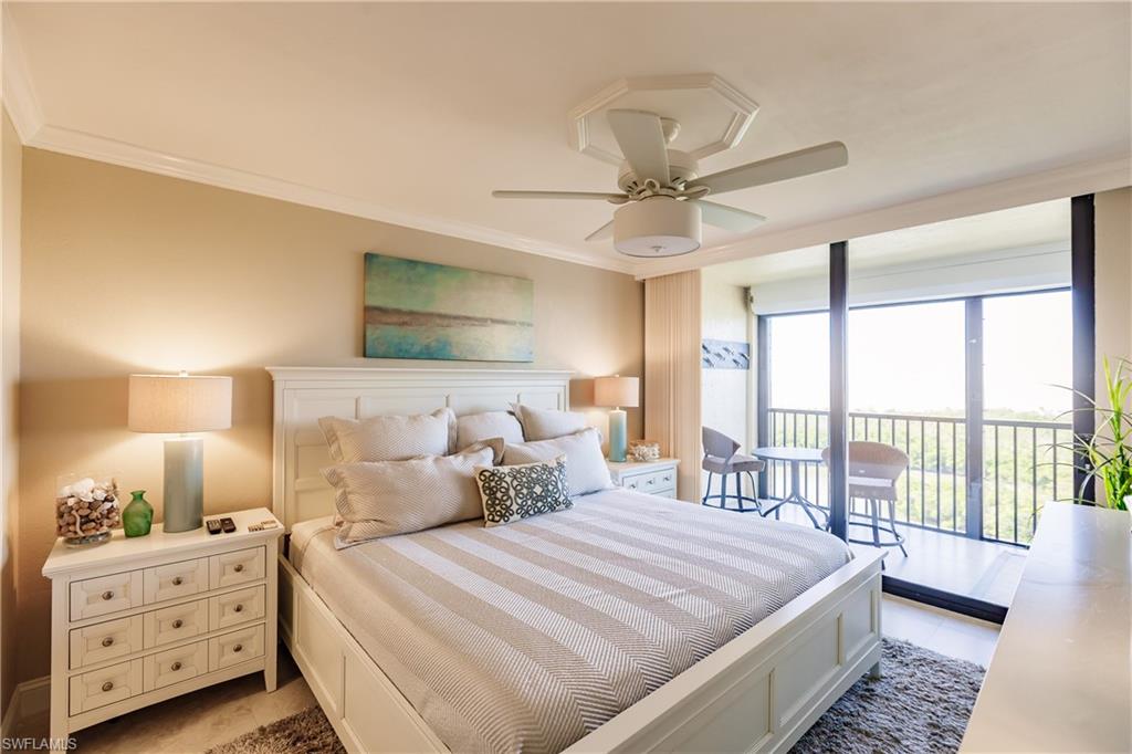 17 Bluebill Avenue, Unit 1005R Naples, FL 34108 - Photo 7 of 33 a bedroom with a bed and a window