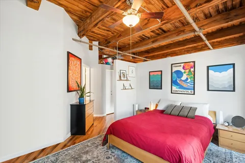 a bedroom with a bed and a dresser