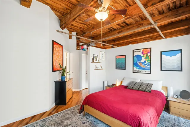 a bedroom with a bed and a dresser