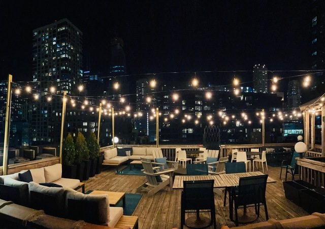 225 West Huron Street, Unit 516 Chicago, IL 60654 - Photo 20 of 20 a view of a patio with dining table and chairs