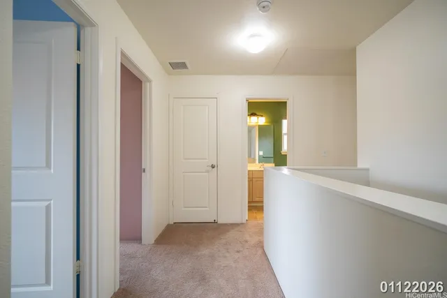a view of a hallway with wooden shelves