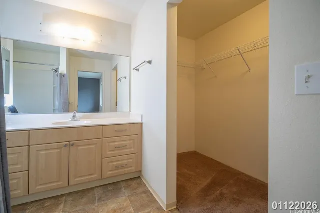 a spacious bathroom with a shower and a sink