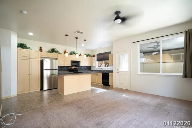 a kitchen with refrigerator and window