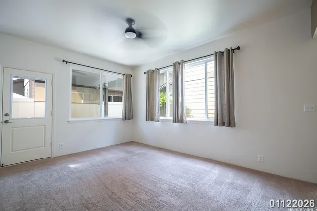an empty room with windows and closet