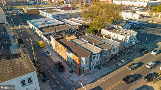 a view of a balcony with chairs and city view