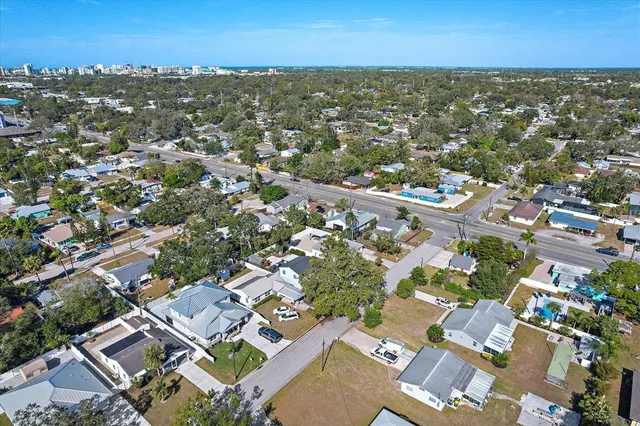 an aerial view of residential building with parking
