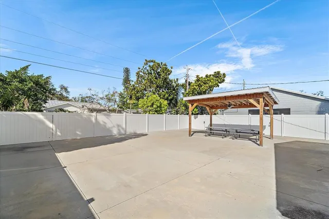 a view of a swimming pool with a patio