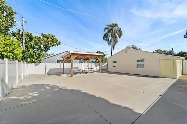 a picture of a house with a yard and garage