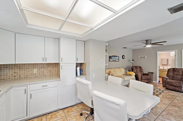 a living room with furniture and white walls
