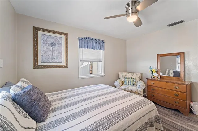 a room with a sink and a bed