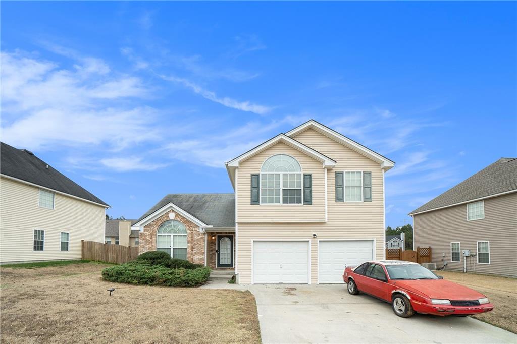 7604 Apostle Road Fairburn, GA 30213 - Photo 1 of 1 a front view of a house with a yard