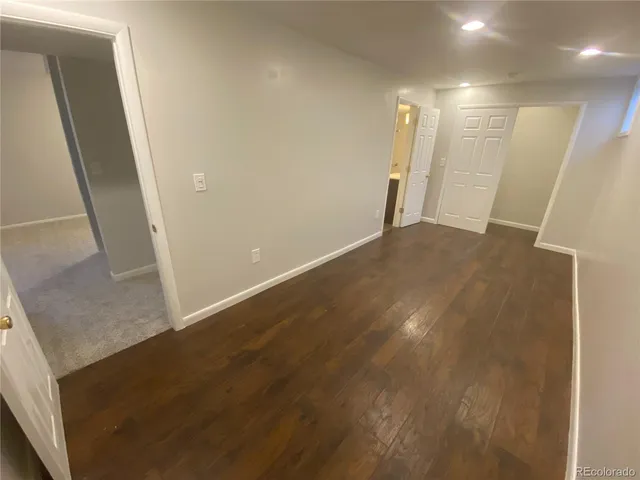 a bathroom with a sink toilet and mirror