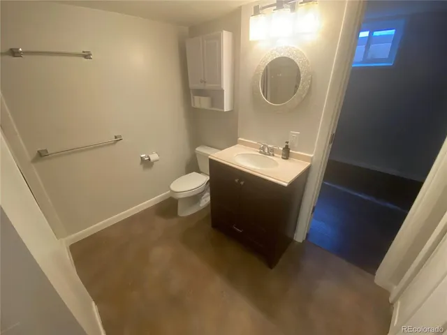 a bathroom with a shower and a sink