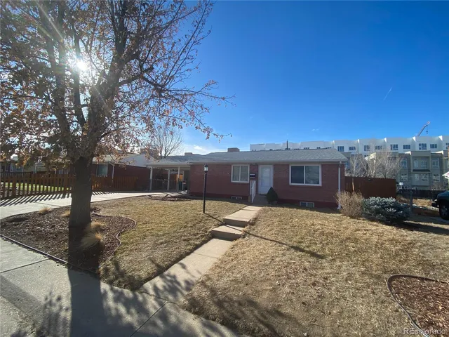 a view of a house with a snow in the yard