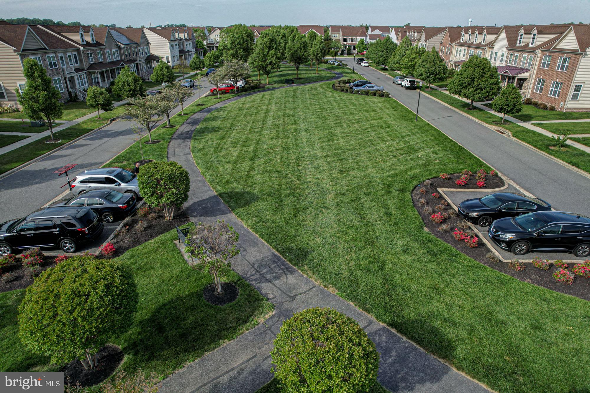 1805 North Pollock Way Middletown, DE 19709 - Photo 11 of 84 Lush green lawns in a serene neighborhood.