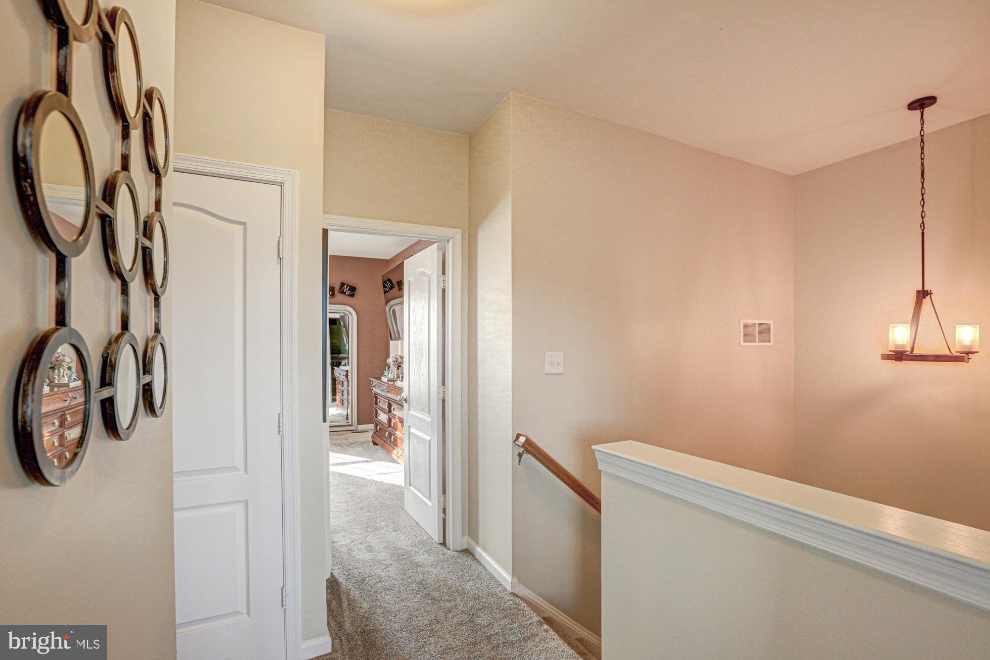 1805 North Pollock Way Middletown, DE 19709 - Photo 41 of 84 Inviting hallway with warm ambiance.