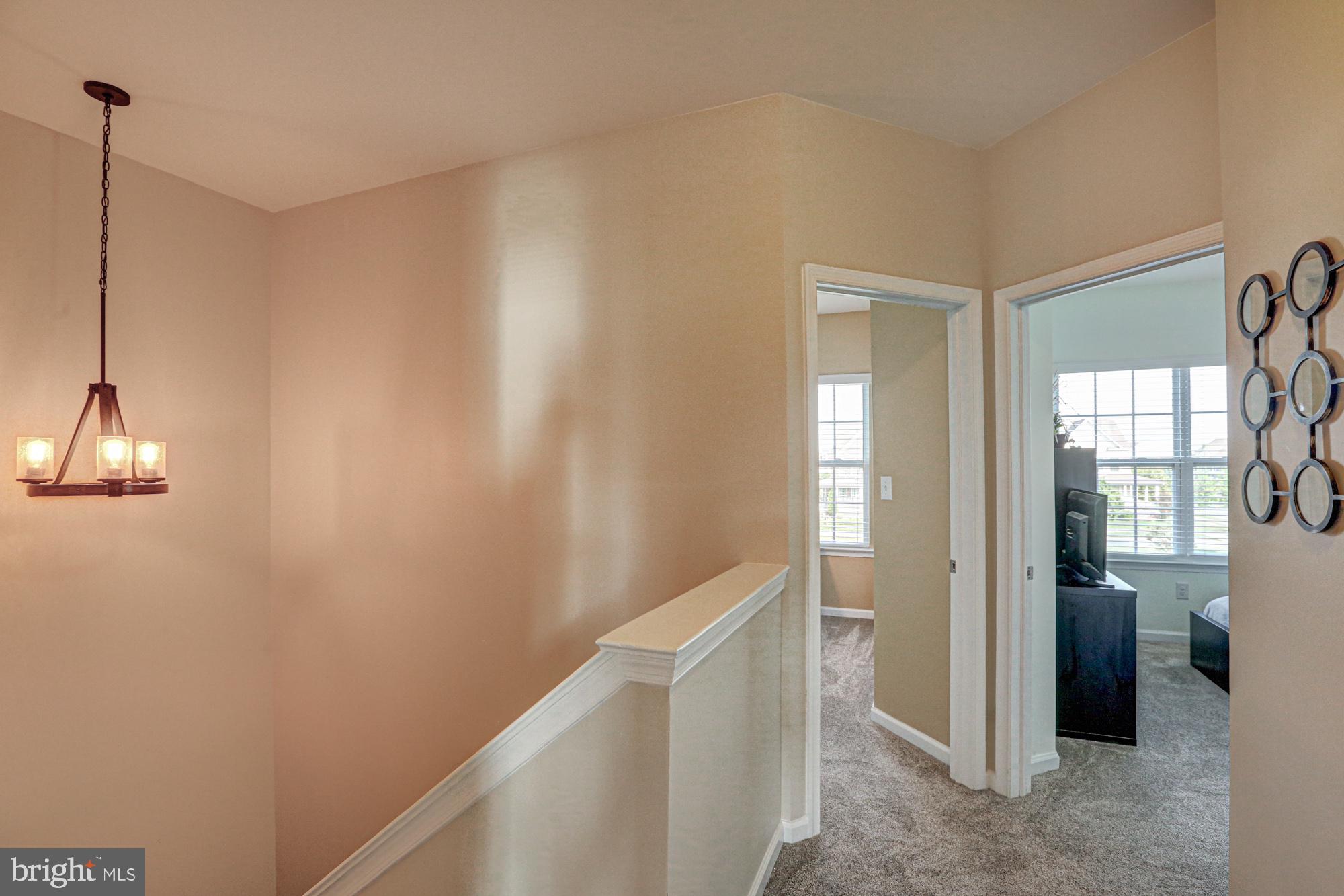 1805 North Pollock Way Middletown, DE 19709 - Photo 42 of 84 Inviting hallway with natural light.