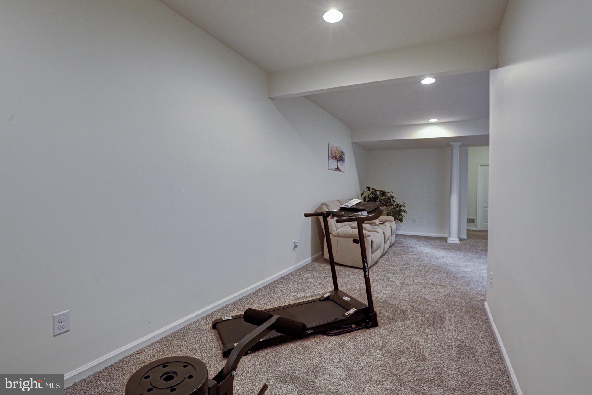 1805 North Pollock Way Middletown, DE 19709 - Photo 71 of 84 Spacious hallway with fitness potential.