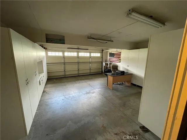 a view of a hallway with seating area