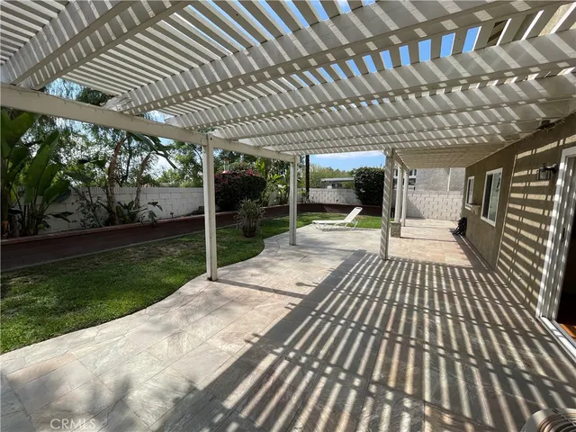 a view of a patio with wooden floor