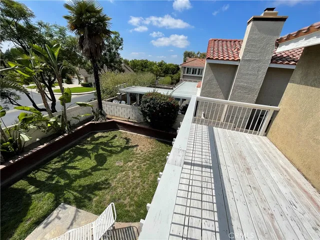 a view of balcony with wooden floor